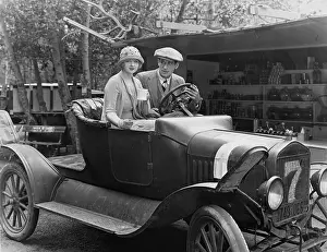 Outings: Couple in an old veteran car