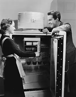Fridge: Couple with open refrigerator