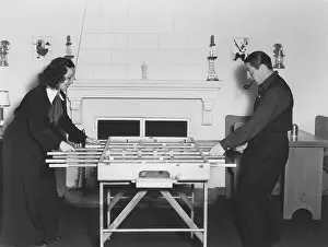 Foosball: Couple playing foosball