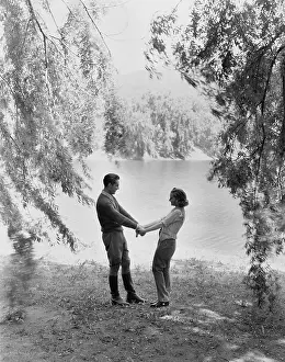 Spontaneity: Couple playing in the garden