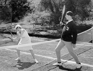 Racquets: Couple playing tennis together