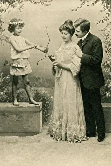 Belle Elise Collection: Couple pose by cupid ?statue?