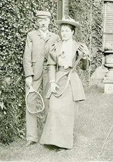 Racquets: Couple posing with tennis rackets