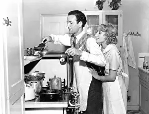 Spatula: Couple preparing a meal together