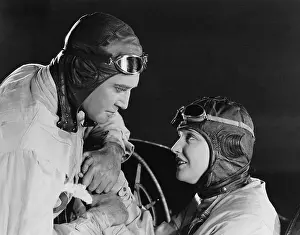 Intensity: Couple in racing hats and goggles