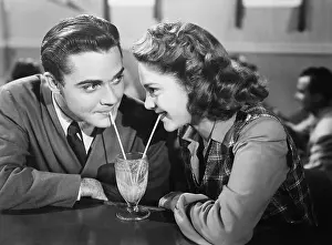 Straws: Couple in a restaurant looking at each other and