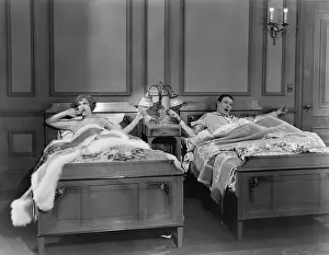 Paneled: Couple in separate beds