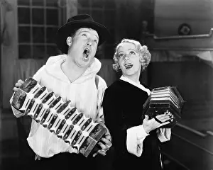 Showmanship: Couple singing while playing two accordions