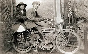 Michael Cole: Couple sitting on 1905 Triumph motorcycle