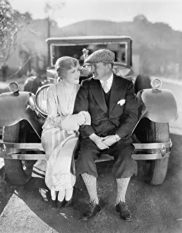 Knickerbockers: Couple sitting together on a car bumper