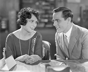 Infatuated: Couple sitting together and flirting