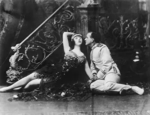 Seducing: Couple sitting on the floor and looking at each other