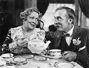 55 60: Couple sitting together having tea