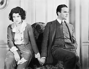 Ignore: Couple sitting together holding hands