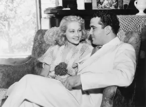 Sofas: Couple sitting together looking lovingly at each other