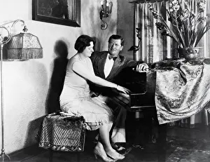 Collaborate: Couple sitting at piano