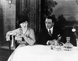 Decanter: Couple sitting at a table in a restaurant looking
