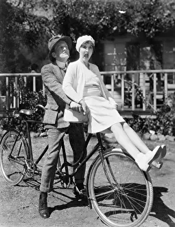 Scream: Couple sitting on a tandem bicycle