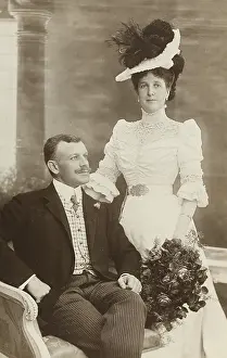 Angerer: Couple - she is standing with bouquet