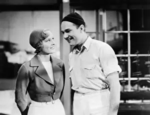 Joyous: Couple standing together and smiling