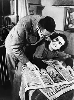 Prefer: A couple studies the cinema program, 1936