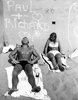 Sunbathe: Couple Sunbath at California Beach