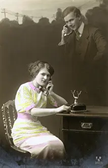 Phones: A couple talking on the telephone