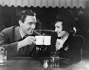 Toasts: Couple toasting with mugs