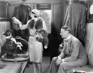 Showmanship: Couple together in a train and feeding a dog
