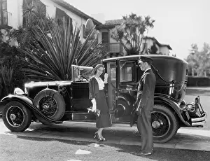 Luxuries: Couple with a veteran car
