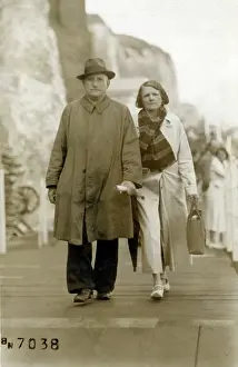 Sullen: Couple walking below the cliffs at Cliftonville, Kent