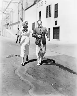 Friendliness: Couple walking together and laughing