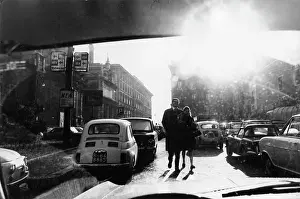 Windscreen: Couple walking through Rome traffic