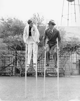 Strive: Couple walking on stilts