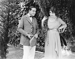 Coquettish: Couple walking and talking with each other