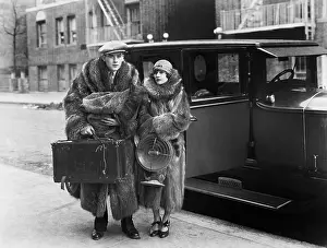 Apprehension: Couple wearing fur coats