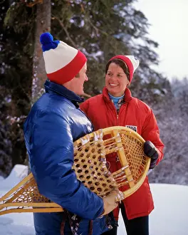 Couple Wearing Down Jackets Talking Smiling on
