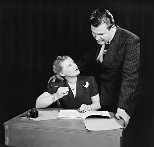 Middle Class: Couple working out budget, ca. 1940. This is an