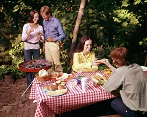 Hamburgers: Two Couples Having Backyard Picnic