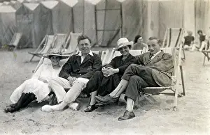 Boyfriends: Couples sit in deckchairs on the beach at Margate, Kent