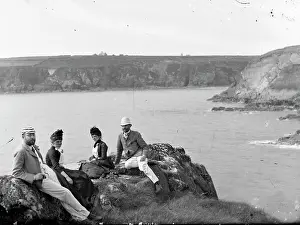 Twins: Two couples sitting on a cliff top