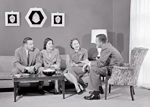 Snacks: Two Couples Sitting Living Room Talking Smiling