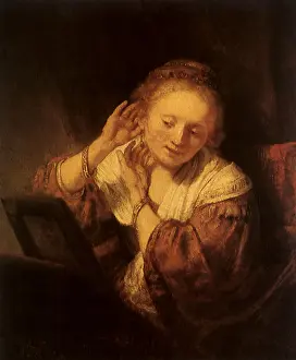 1654: A Courtesan at her Mirror, by Rembrandt