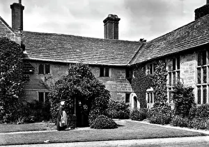 Milkmaid: Courtyard garden of a house, with milkmaid