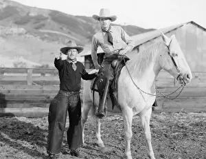 Saddled: Two cowboys and a white horse