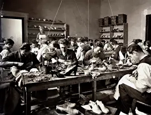 Cobblers: Craftsmen making shoes. 1937