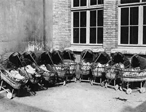Creches: A CRESCENT OF PRAMS