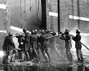 Waterproofs: Crew of firefighters in action, WW2