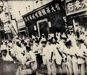 Petition: The Crowd Looks at Leaflets Distributed by the Protesters