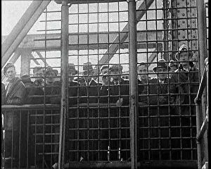 Illegal: A Crowd of Male Civilians Watching A Group